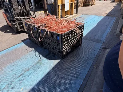 Copper wire loaded in a crate at a loading dock