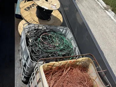 Wire spools staged in an open field