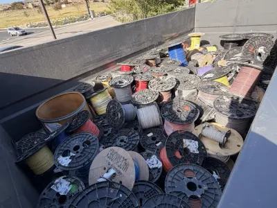 Wire spools stored on a warehouse rack
